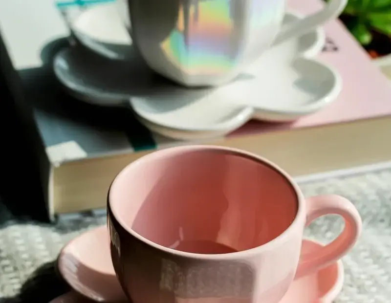 Budget home decor before and after: thrifted teacups on a gray shelf