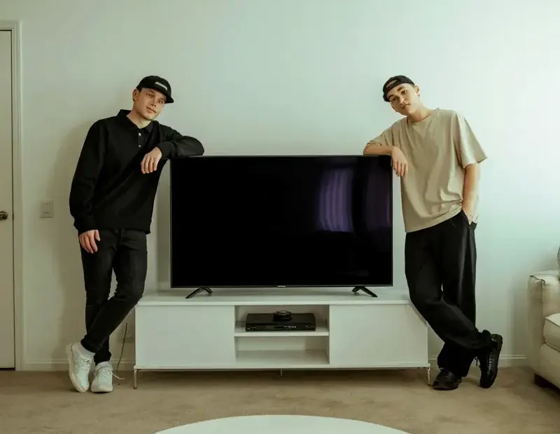 Minimalist Living Room Makeover Before & After | Black TV Wall, White Console, Smiley Rug